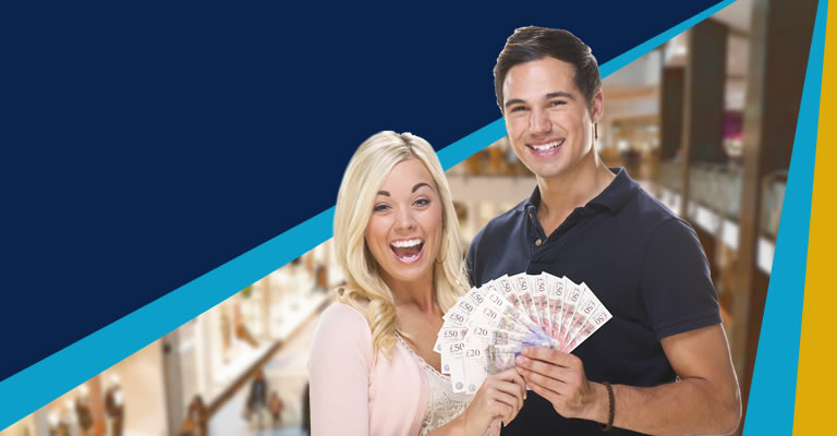 Happy couple holding cash
