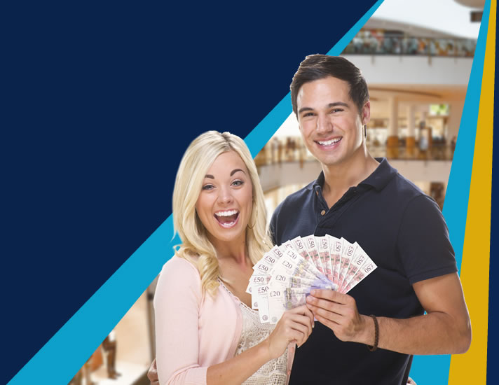 Happy couple holding cash